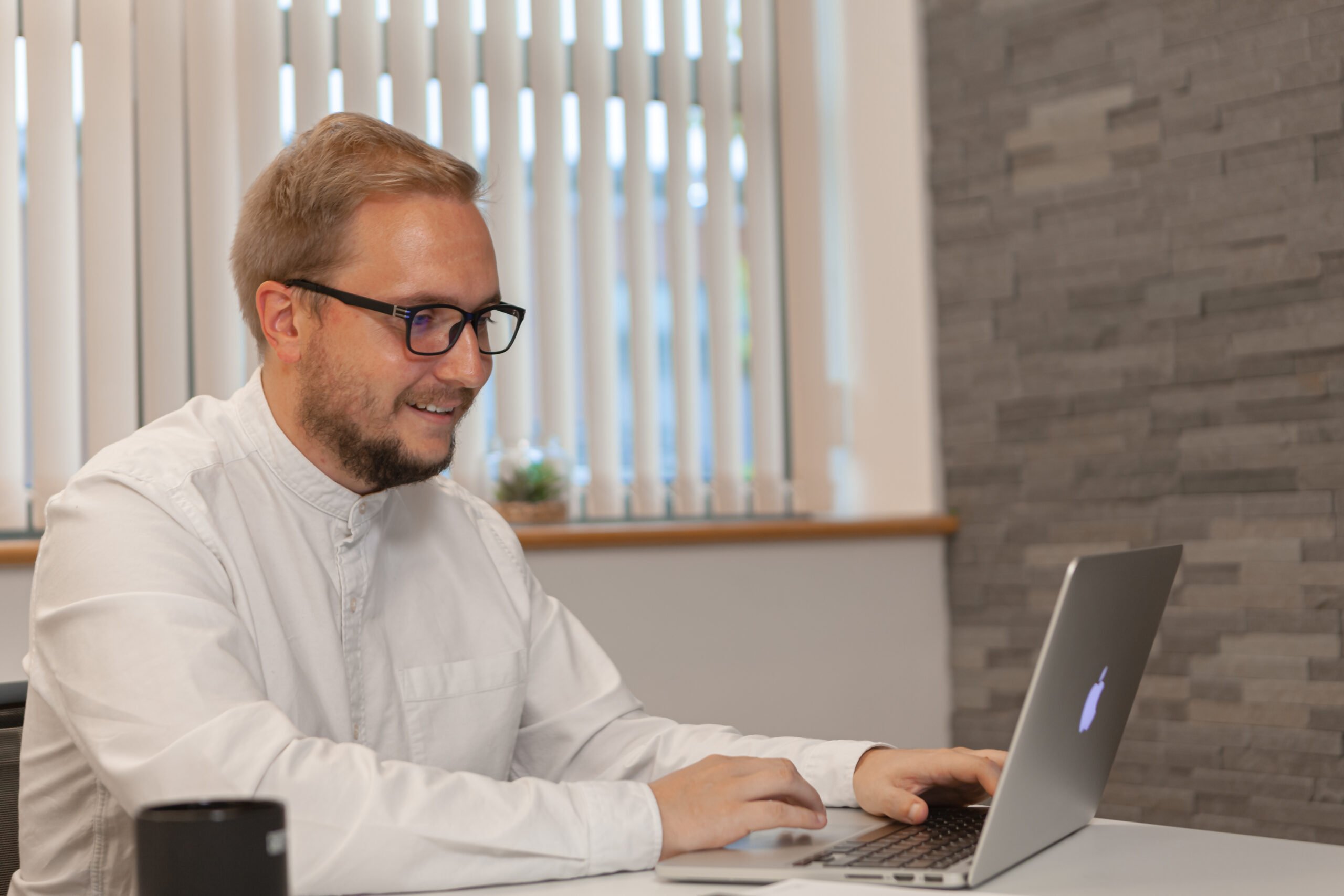 Liam working at his desk